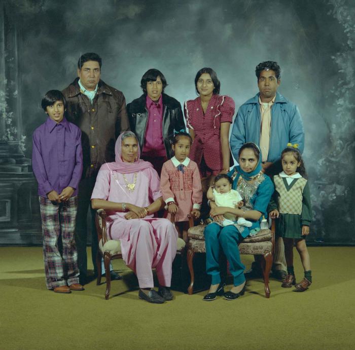 [Group portrait of two unidentified men, two unidentified women and six unidentified children]