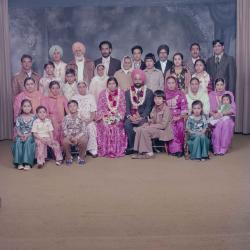 [Group portrait of Baljinder Gill, Gurcharah Dhaliwal and the wedding guests]