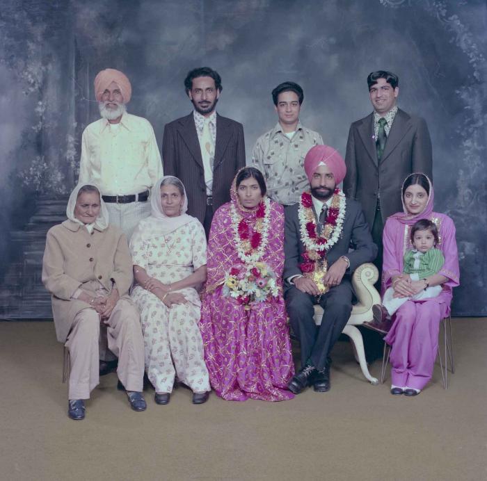 [Group portrait of Baljinder Gill, Gurcharah Dhaliwal and the wedding guests]