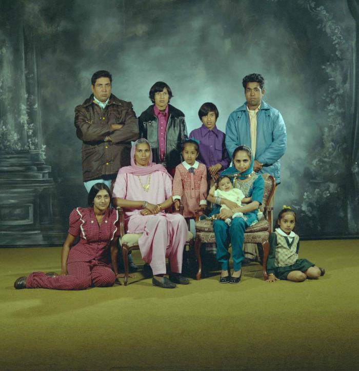 [Group portrait of two unidentified men, two unidentified women and six unidentified children]
