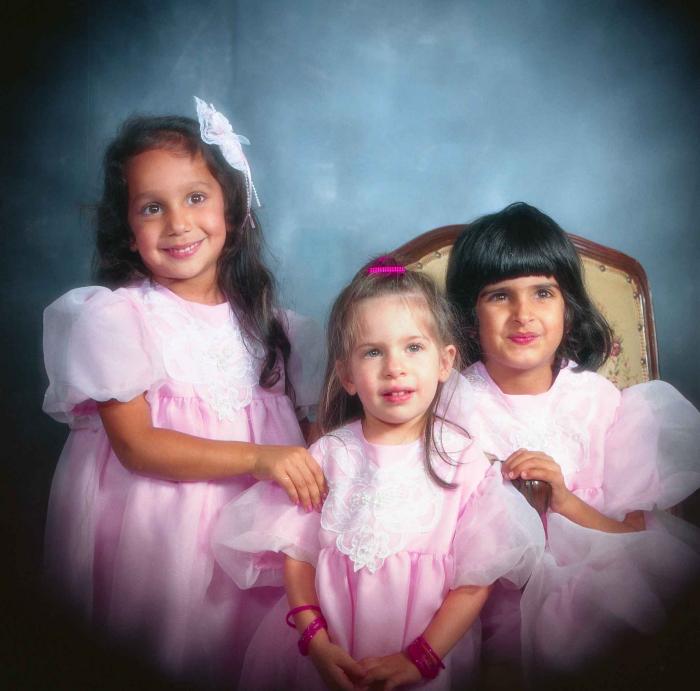 [Portrait of three unidentified children]