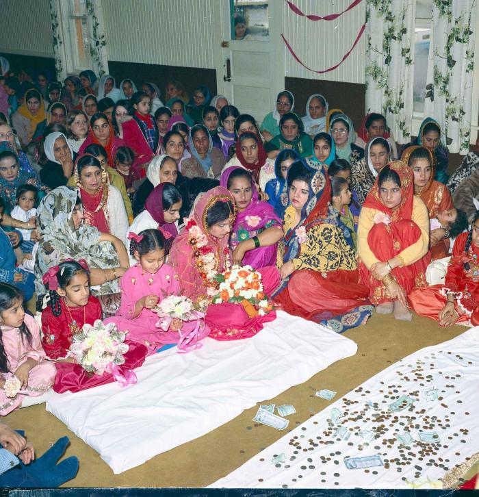 [Group photo of unidentified  bride with wedding guests]