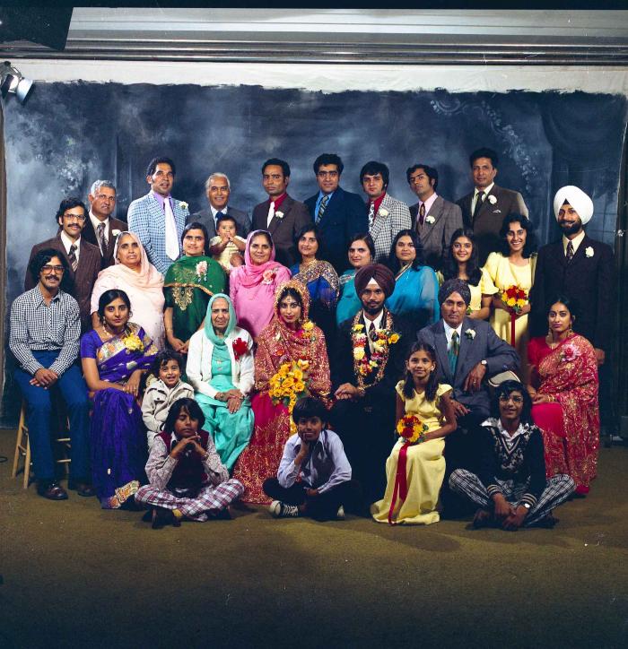 [Group photo of Balbir Khangura and Baljit Gill with wedding guests]