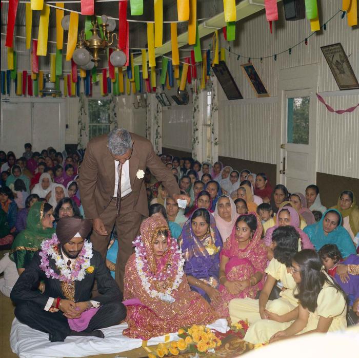 [Group photo of Balbir Khangura and Baljit Gill with wedding guests]