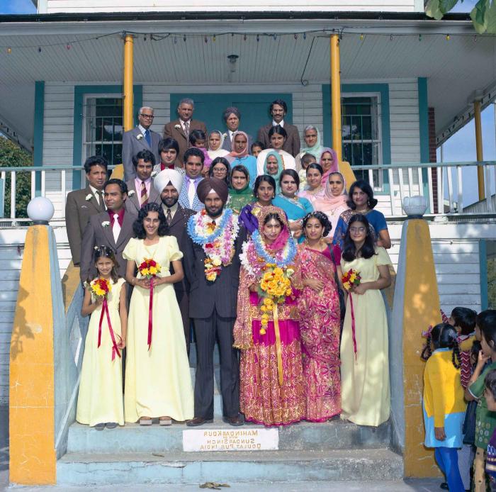 [Group photo of Balbir Khangura and Baljit Gill with wedding guests]