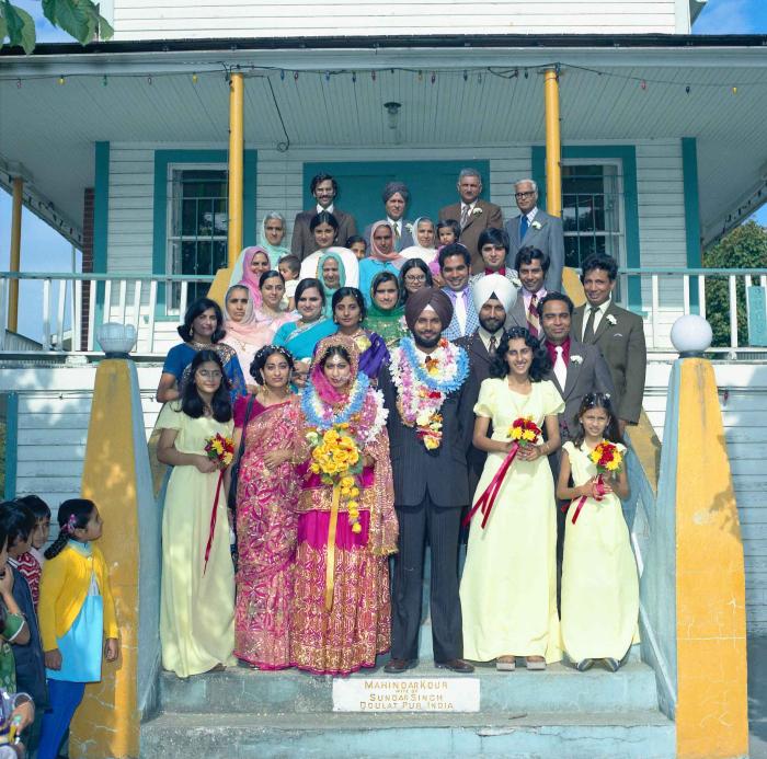[Group photo of Balbir Khangura and Baljit Gill with wedding guests]