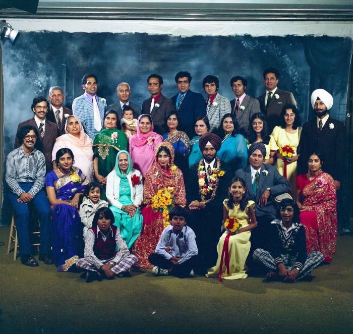 [Group photo of Balbir Khangura and Baljit Gill with wedding guests]