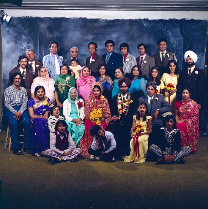 [Group photo of Balbir Khangura and Baljit Gill with wedding guests]