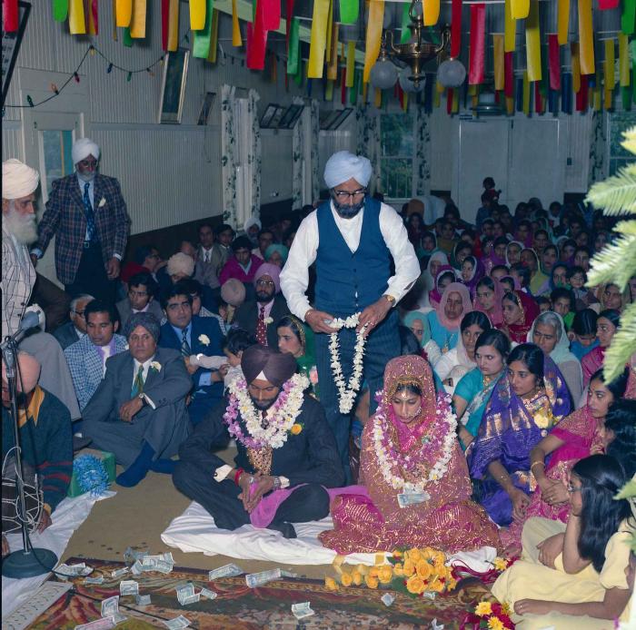 [Group photo of Balbir Khangura and Baljit Gill with wedding guests]