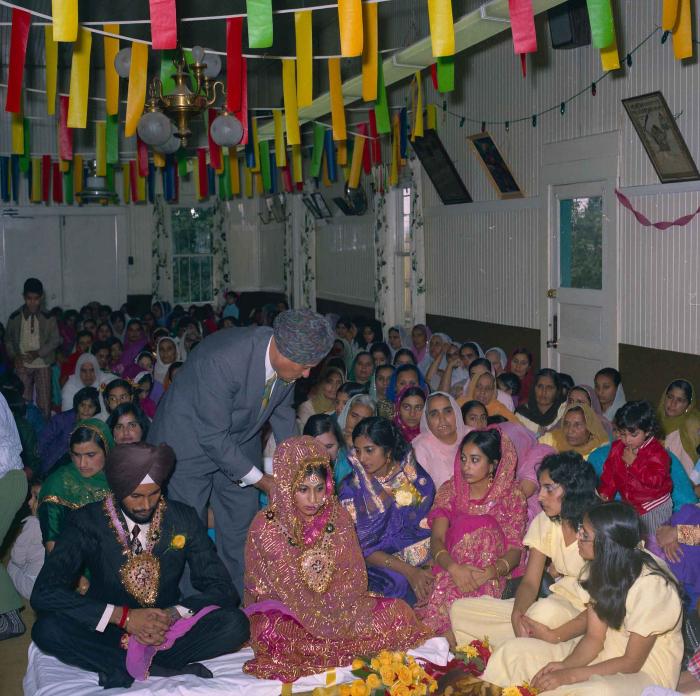 [Group photo of Balbir Khangura and Baljit Gill with wedding guests]