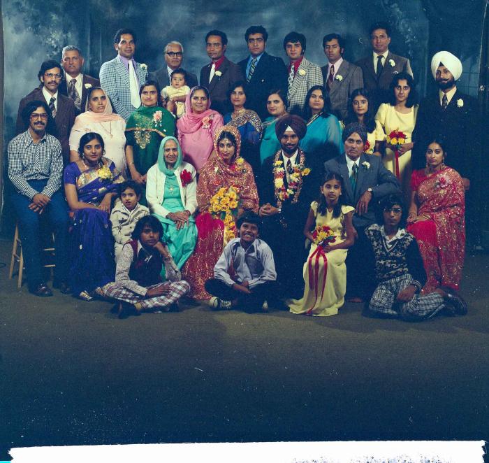 [Group photo of Balbir Khangura and Baljit Gill with wedding guests]