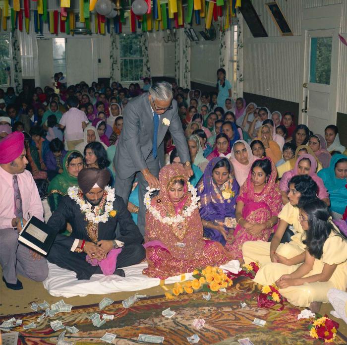 [Group photo of Balbir Khangura and Baljit Gill with wedding guests]