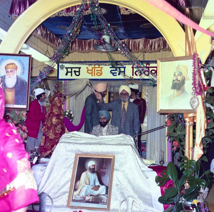 [Group photo of Inderjit Cheema and unidentified bride during marriage ritual]