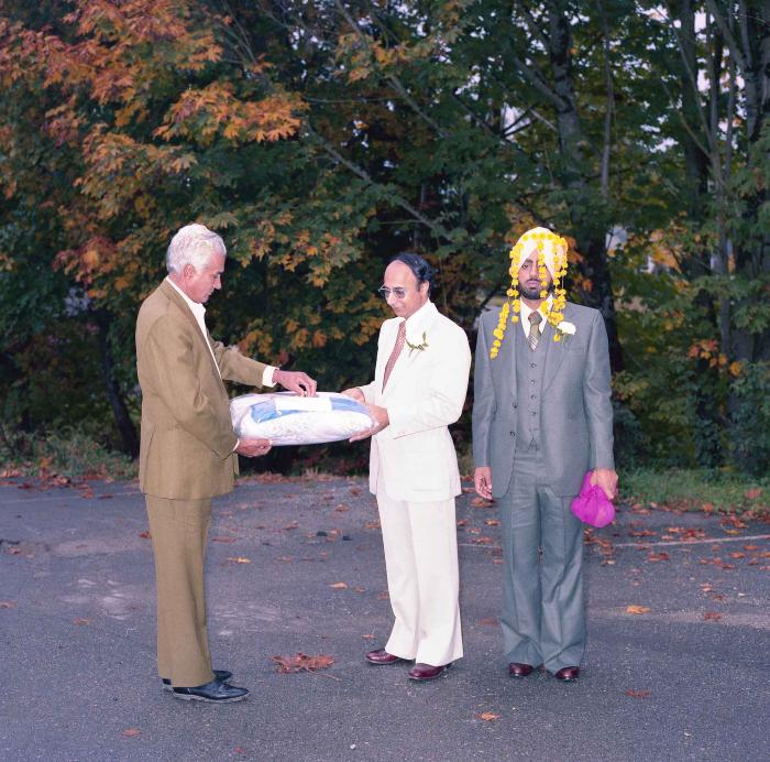 [Group photo of Inderjit Cheema and two unidentified men]