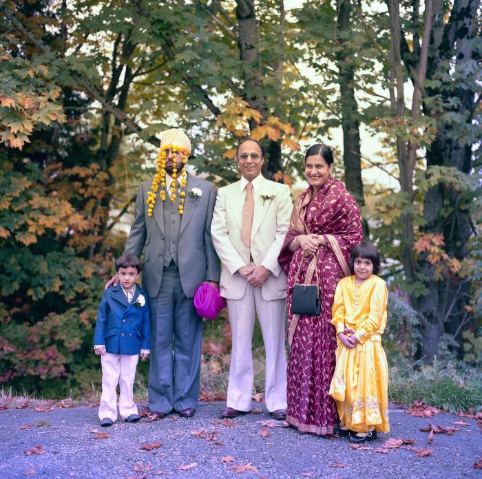 [Group photo of Inderjit Cheema with wedding guests]