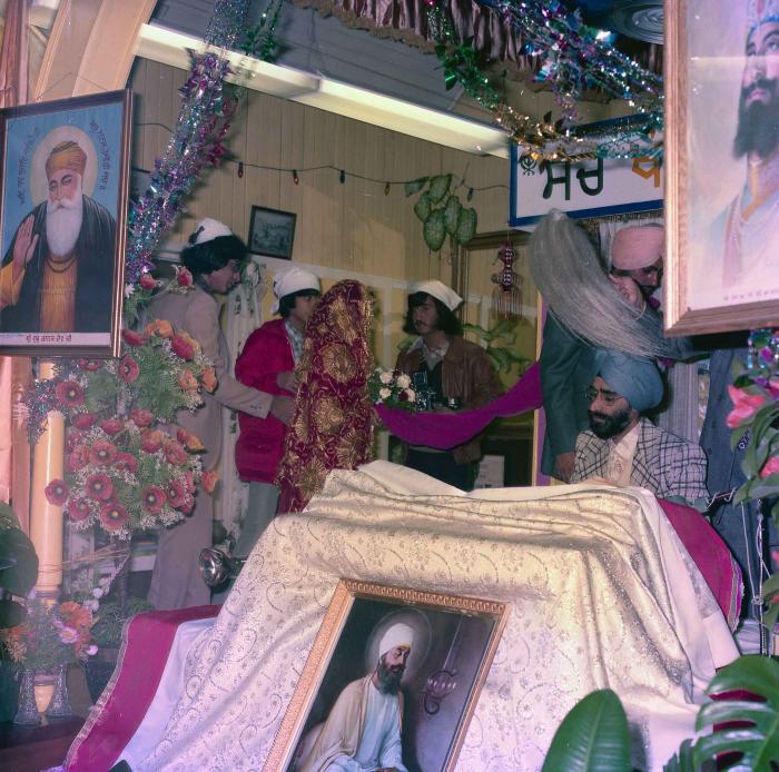 [Group photo of Inderjit Cheema and unidentified  bride during marriage ritual]