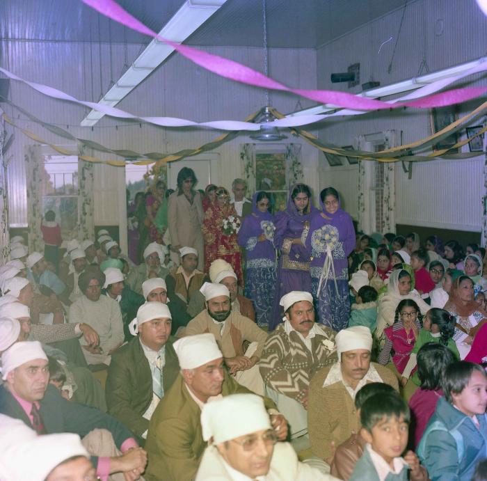 [Group photo of unidentified bride with wedding guests]