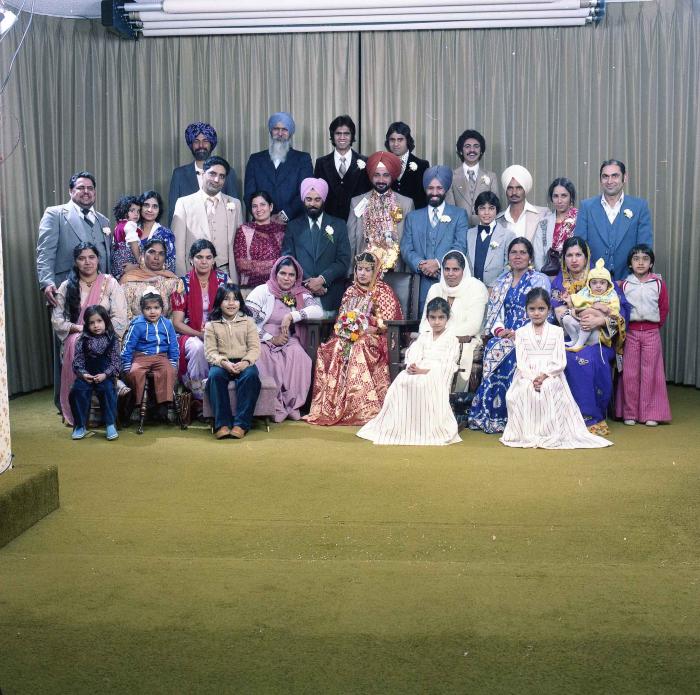[Group photo of Parm Cheema and Swaren Dhaliwal with family members]