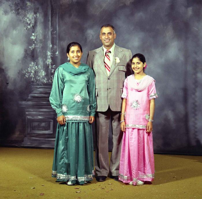 [Portrait of Lal S. Cheema with two unidentified girls]