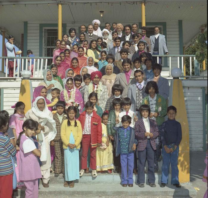 [Group photo of Kehar S. Cheema and unidentified bride with wedding guests at Gur Sikh Temple]