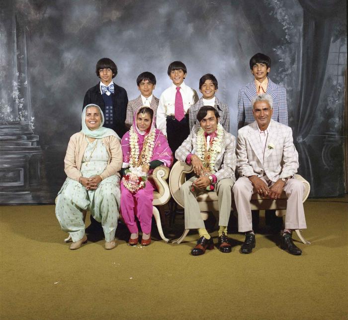[Group photo of Kehar S. Cheema and unidentified bride with wedding guests]