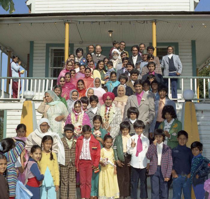 [Group photo of Kehar S. Cheema and unidentified bride with wedding guests at Gur Sikh Temple]