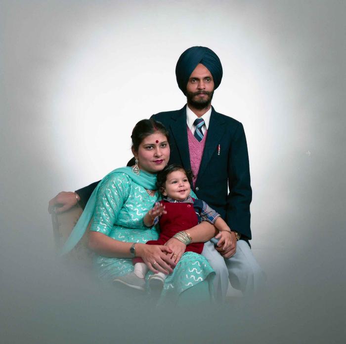 [Portrait of Kesar Singh Chera and an unidentified woman with a child]