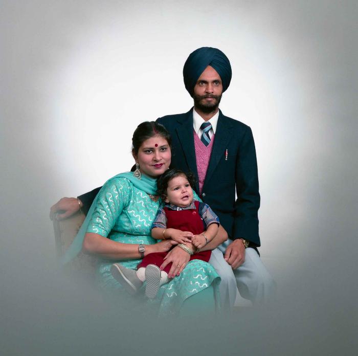 [Portrait of Kesar Singh Chera and an unidentified woman with a child]