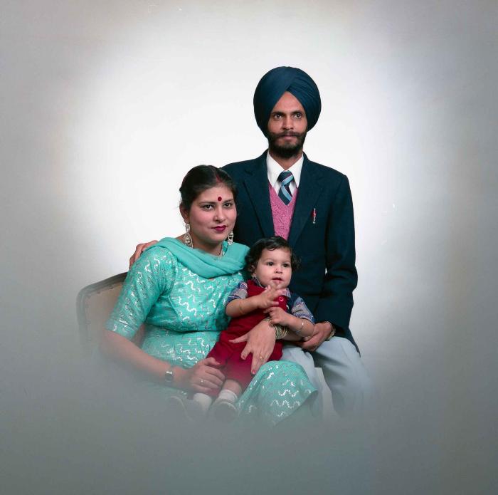 [Portrait of Kesar Singh Chera and an unidentified woman with a child]