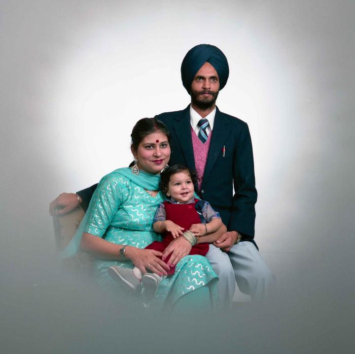 [Portrait of Kesar Singh Chera and an unidentified woman with a child]