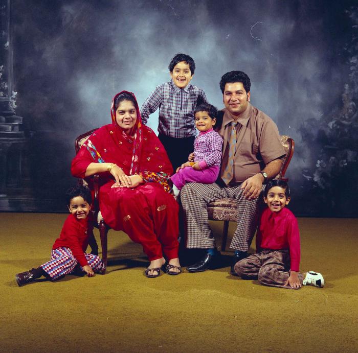 [Group photo of Amrik Grewal with his family]