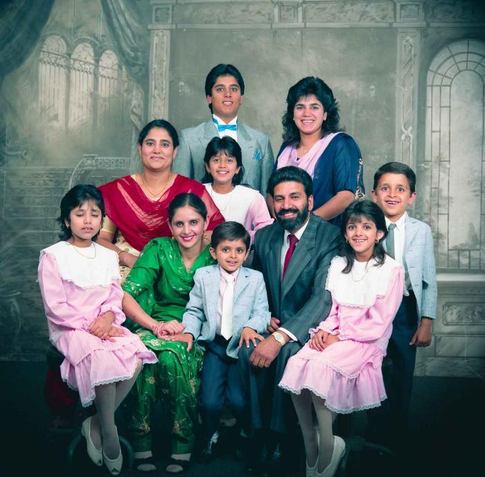 [Group photo of Gremail Dhaliwal and his family]