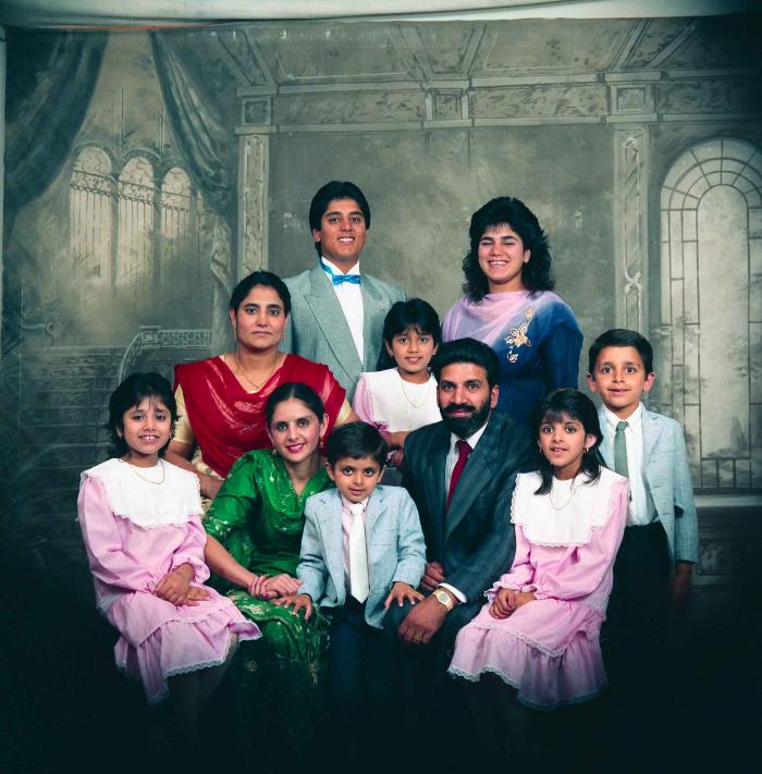 [Group photo of Gremail Dhaliwal and his family]