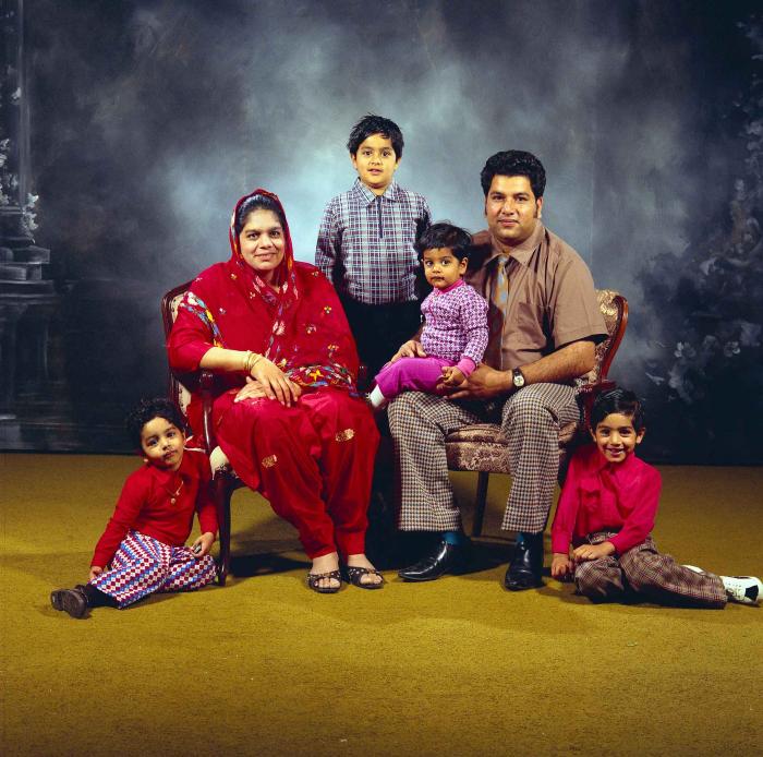 [Group photo of Amrik Grewal with his family]