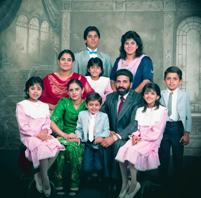 [Group photo of Gremail Dhaliwal and his family]