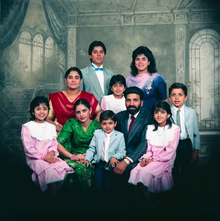 [Group photo of Gremail Dhaliwal and his family]