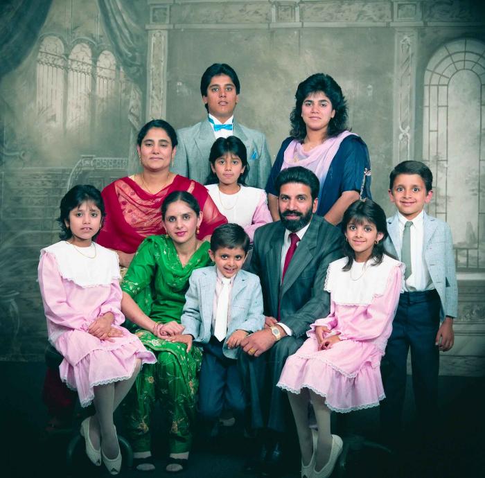 [Group photo of Gremail Dhaliwal and his family]