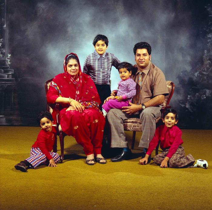 [Group photo of Amrik Grewal with his family]