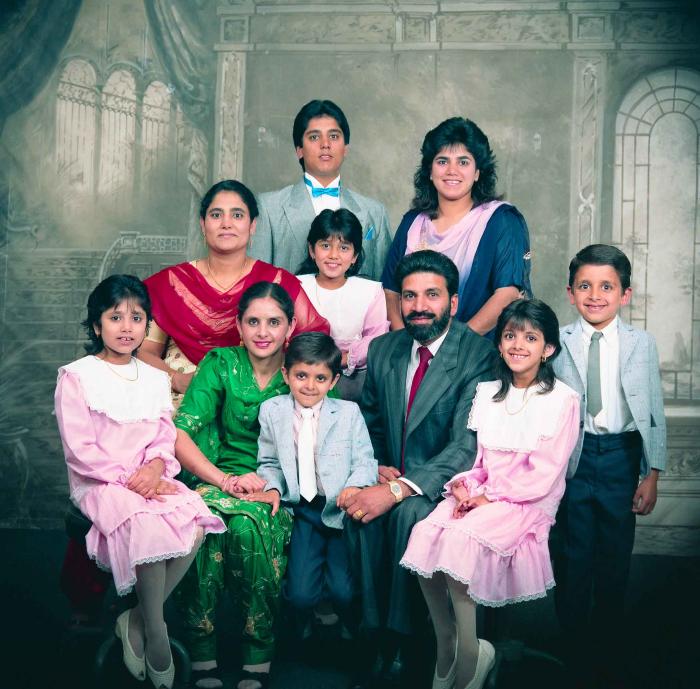 [Group photo of Gremail Dhaliwal and his family]