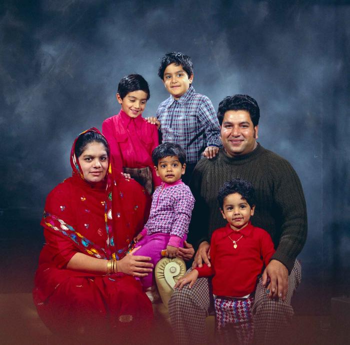 [Group photo of Amrik Grewal with his family]