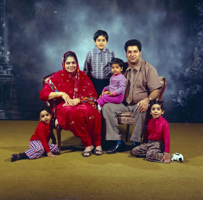[Group photo of Amrik Grewal with his family]