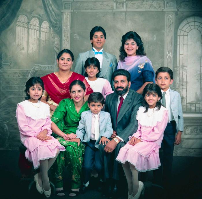 [Group photo of Gremail Dhaliwal and his family]