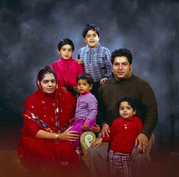 [Group photo of Amrik Grewal with his family]