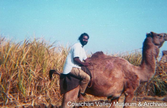 [Unidentified man riding a camel]