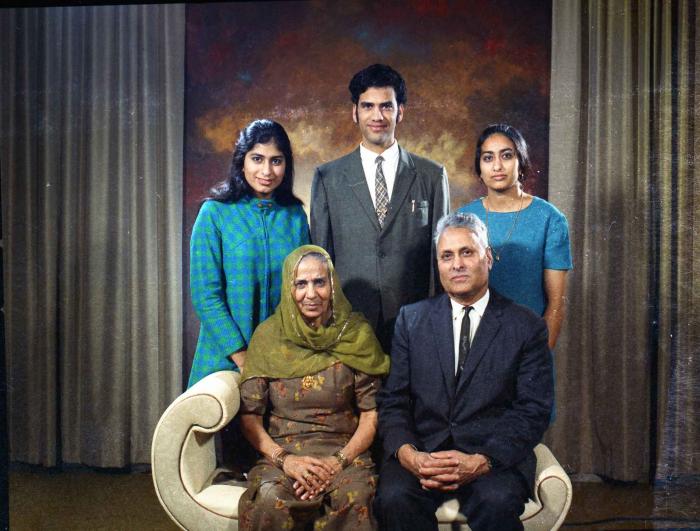 [Group photo of Indar Singh Gill and Kartar Kaur Gill, with their children]