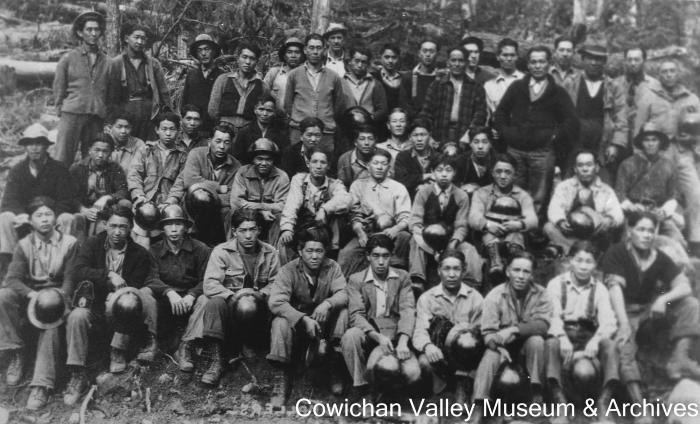 [Unidentified group of workers posing for group portrait]