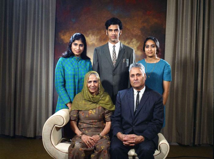 [Group photo of Indar Singh Gill and Kartar Kaur Gill, with their children]
