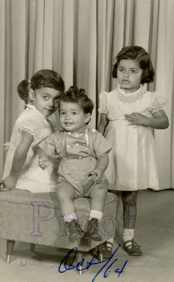 [Photo of three children]