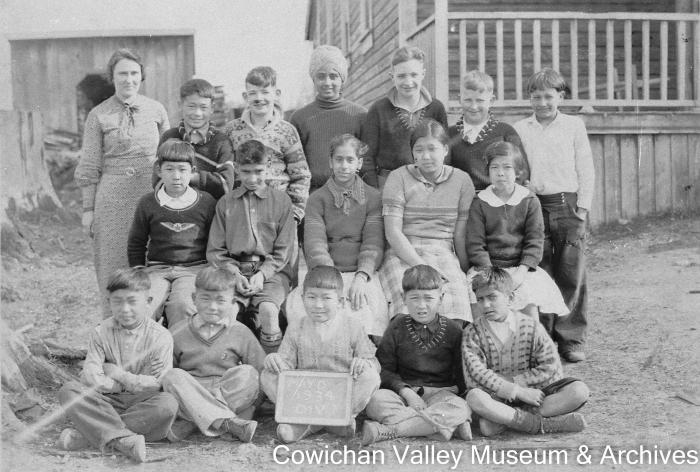 [Group of unidentified school children and teacher at Mayo School posing for class portrait]