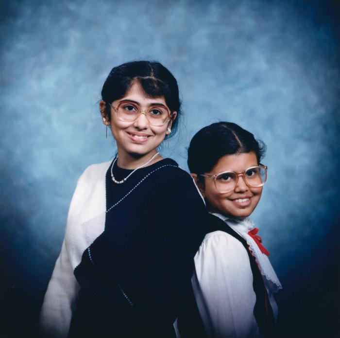 [Photo of Sukhdarshan Gill's daughters]